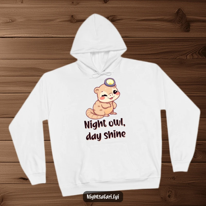 Funny winking pangolin wearing a headlamp slithering, featured on a cozy hoodie for fans of quirky creatures.