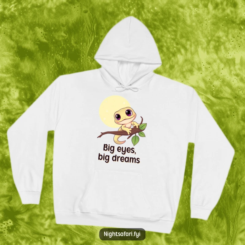 Funny hoodie featuring a cute gecko with big eyes, holding onto a moonlit branch, radiating warmth.