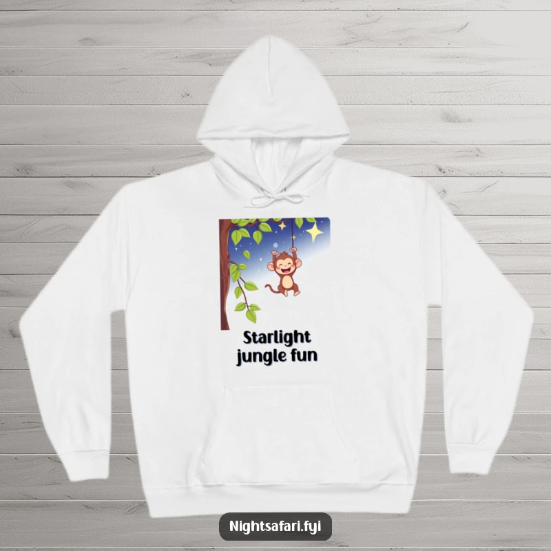 Funny hoodie with a playful monkey swinging gleefully from a vine under a starry sky, cozy fun.