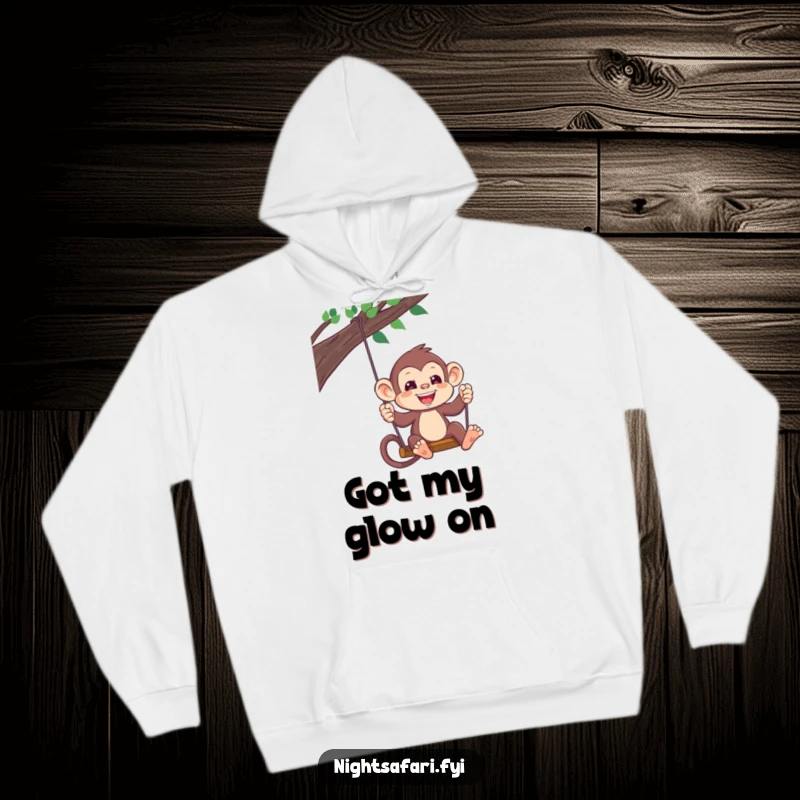 Funny Monkey Headlamp Hoodie: A playful monkey wearing a headlamp swings, offering warmth and adventure, a cozy funny gift.